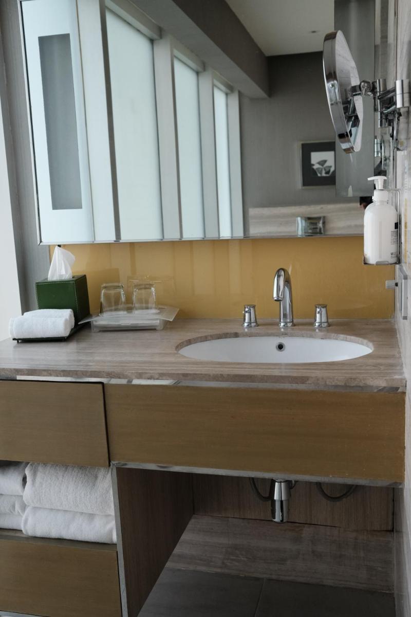 a bathroom with a sink and a mirror at Holiday Inn New Delhi Aerocity by IHG in New Delhi