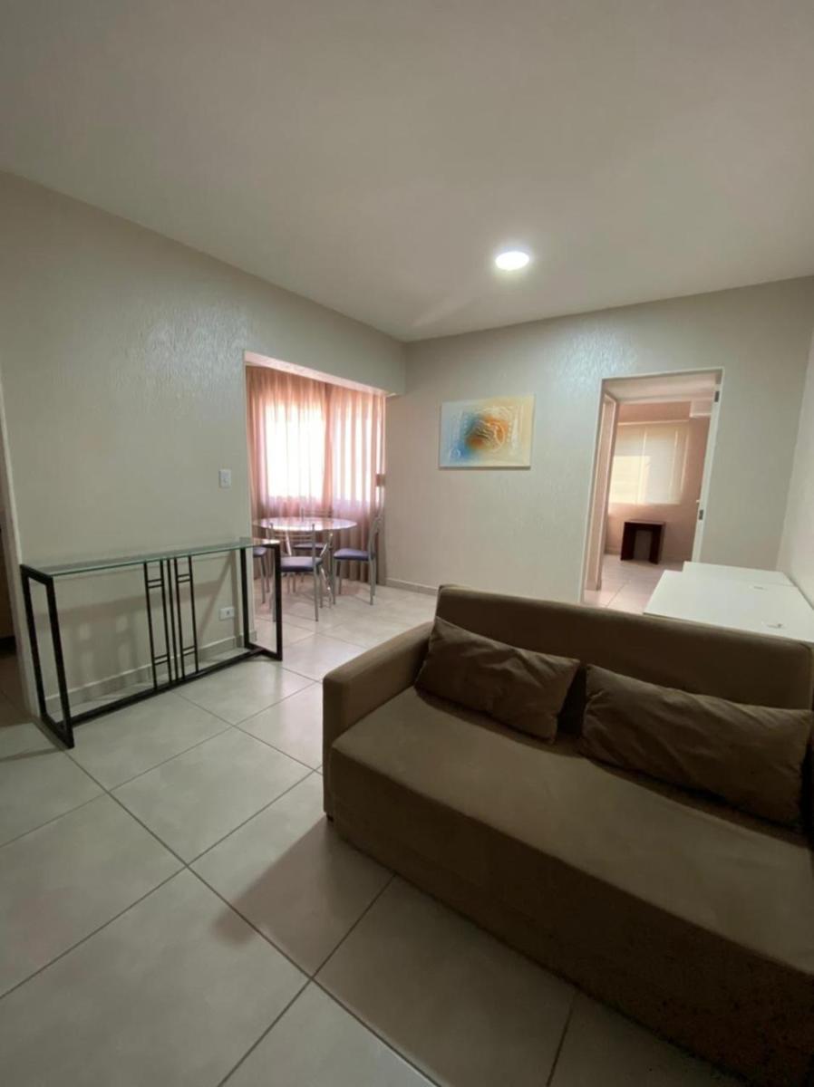 Ap flat central- ar, garagem e ótima localização - Housity