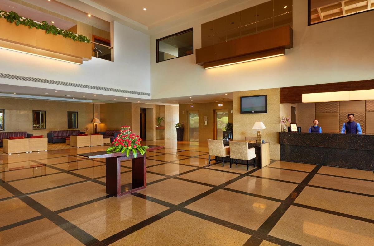 a lobby of a hotel with a waiting room at Park Plaza Chennai OMR in Chennai