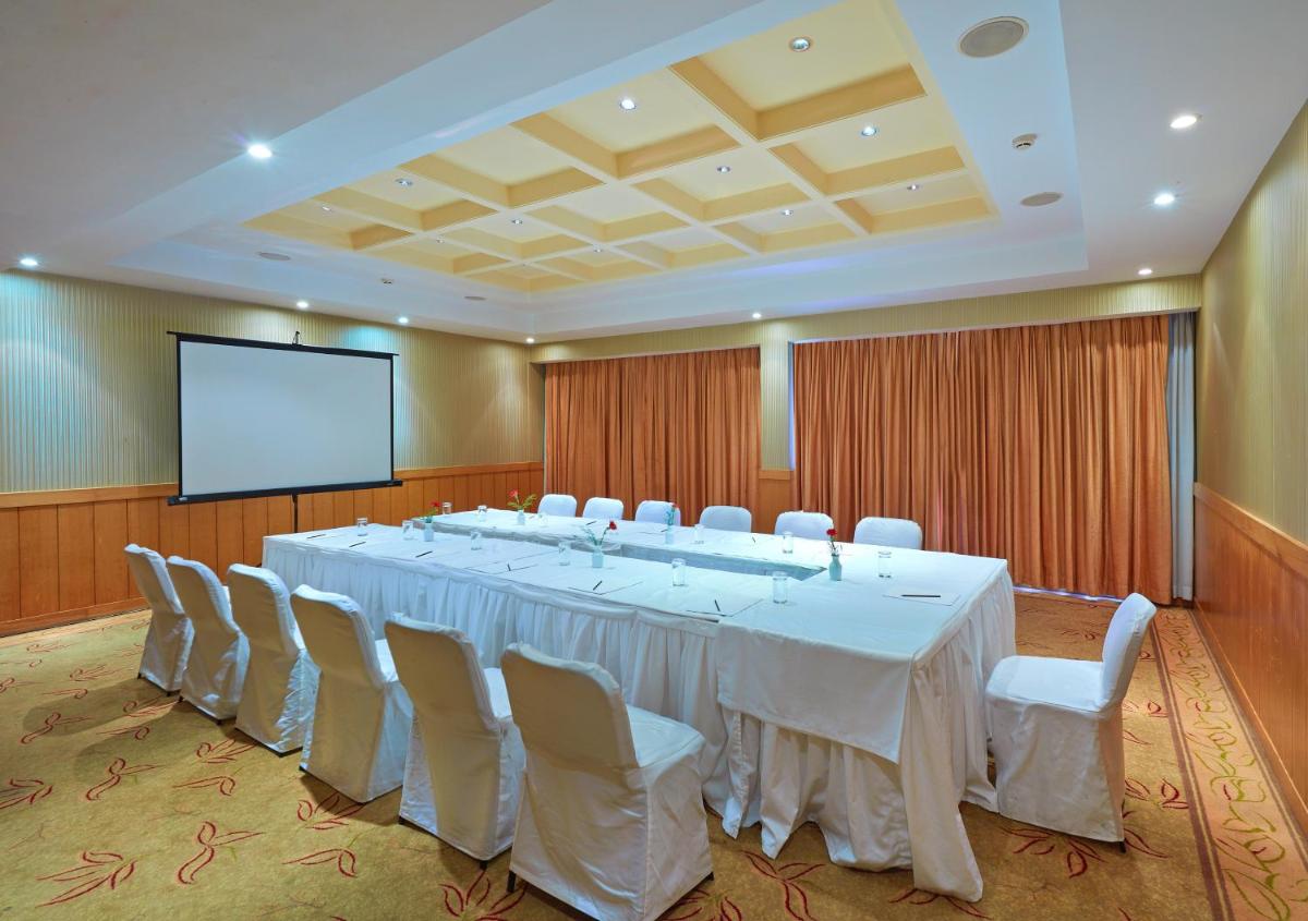 a large conference room with a long table and chairs at Park Plaza Chennai OMR in Chennai