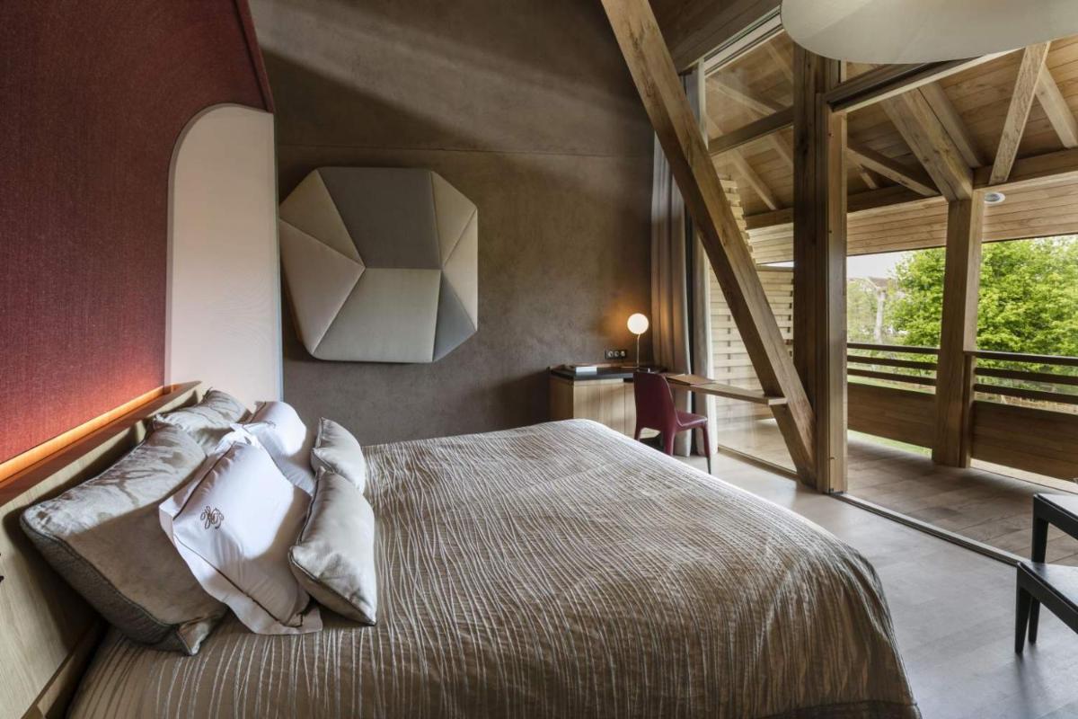 Un ou plusieurs lits dans un hébergement de l'établissement Hotel des Berges, Restaurant Gastronomique & Spa