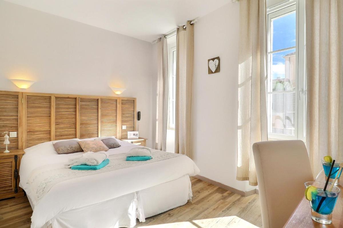 Un ou plusieurs lits dans un hébergement de l'établissement Grand Hôtel des Bains SPA