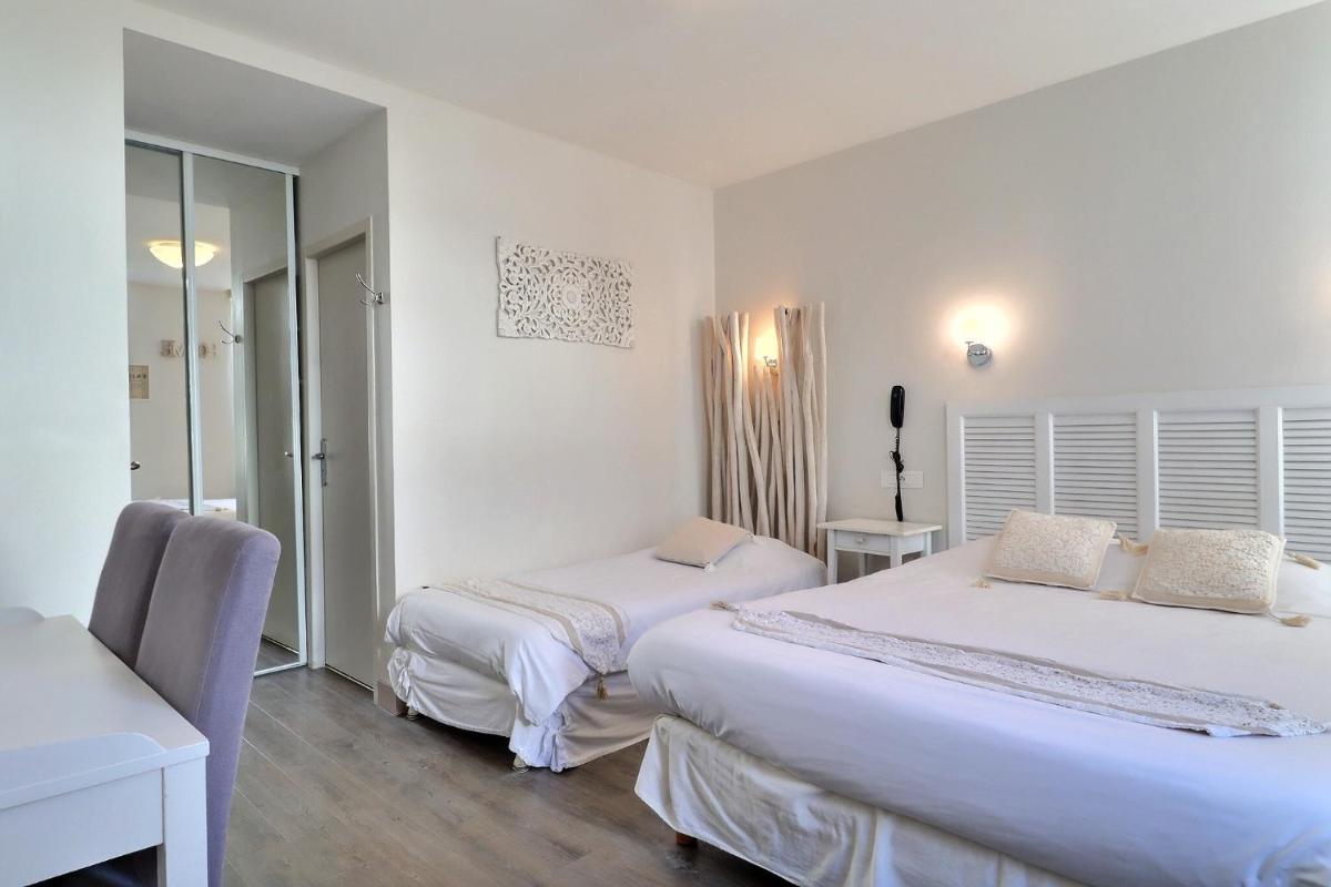 Un ou plusieurs lits dans un hébergement de l'établissement Grand Hôtel des Bains SPA
