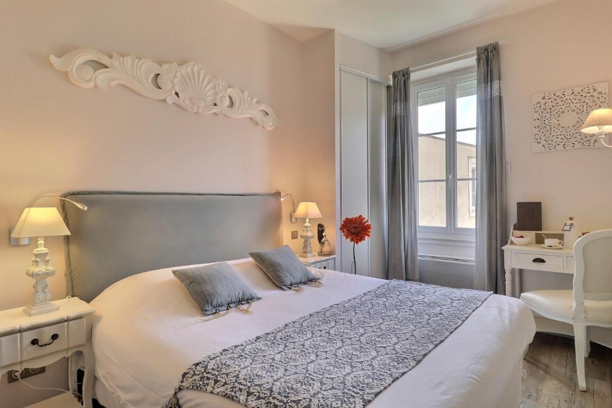Un ou plusieurs lits dans un hébergement de l'établissement Grand Hôtel des Bains SPA