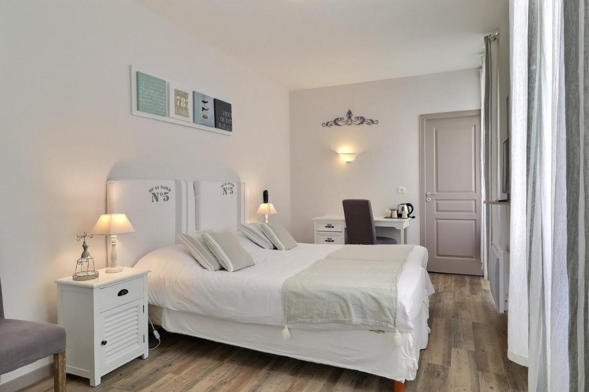 Un ou plusieurs lits dans un hébergement de l'établissement Grand Hôtel des Bains SPA