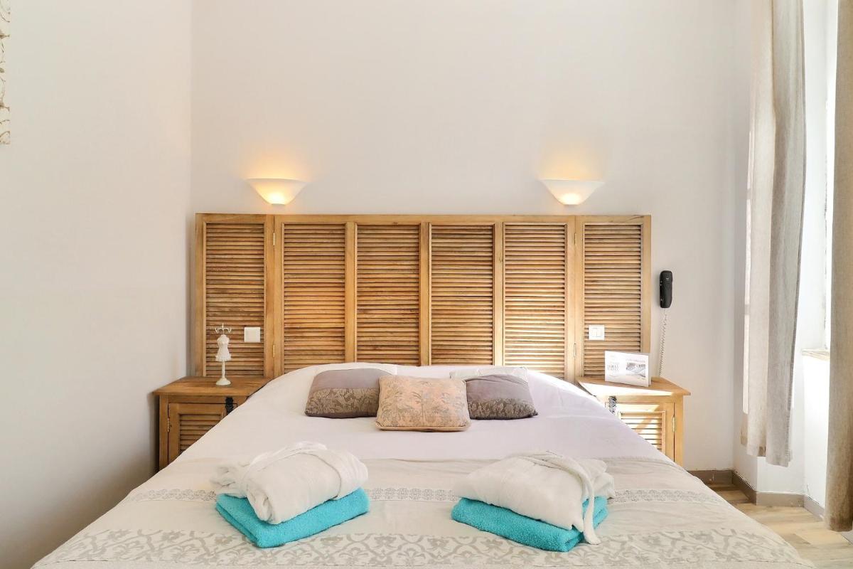 Un ou plusieurs lits dans un hébergement de l'établissement Grand Hôtel des Bains SPA
