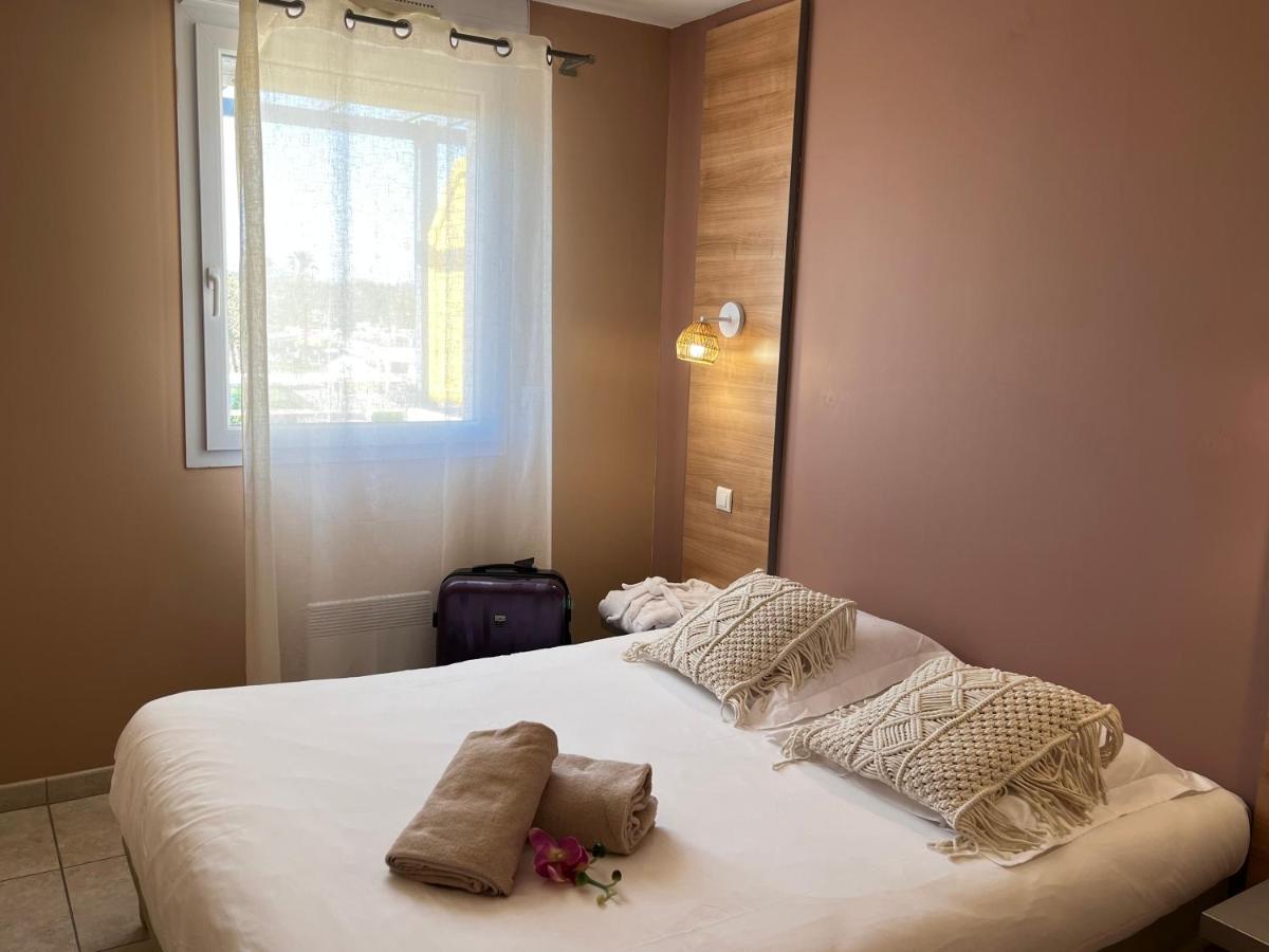 Un ou plusieurs lits dans un hébergement de l'établissement Résidence Hôtelière Natureva & Spa