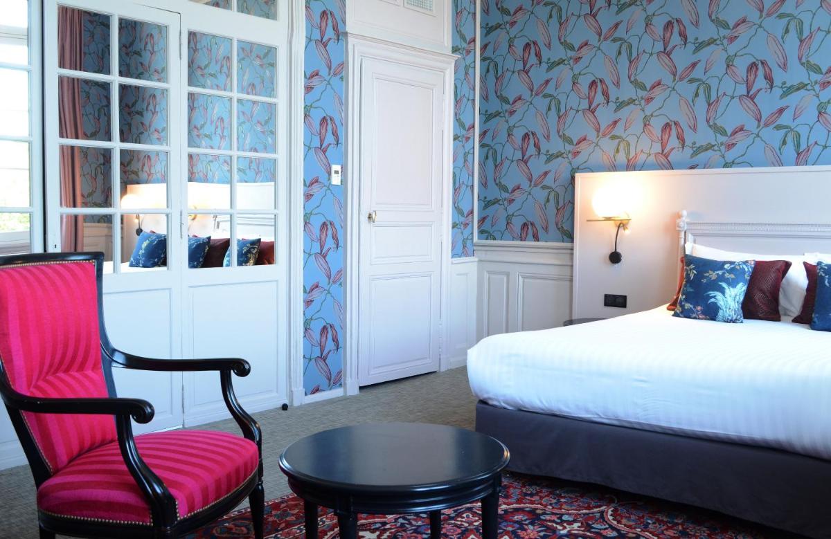Un ou plusieurs lits dans un hébergement de l'établissement Hôtel Anne d'Anjou, The Originals Collection