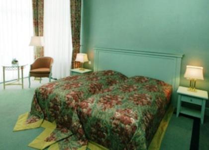 Ein Bett oder Betten in einem Zimmer der Unterkunft Usedom Palace
