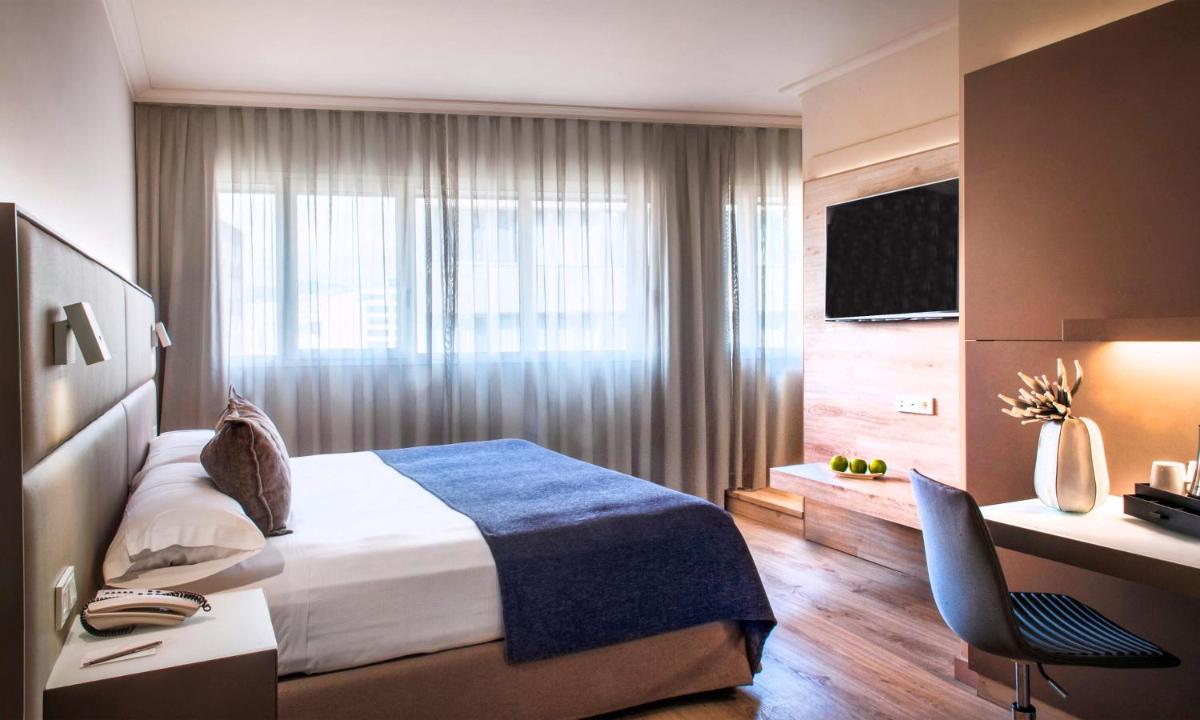 Cama o camas de una habitación en Sallés Hotel Pere IV
