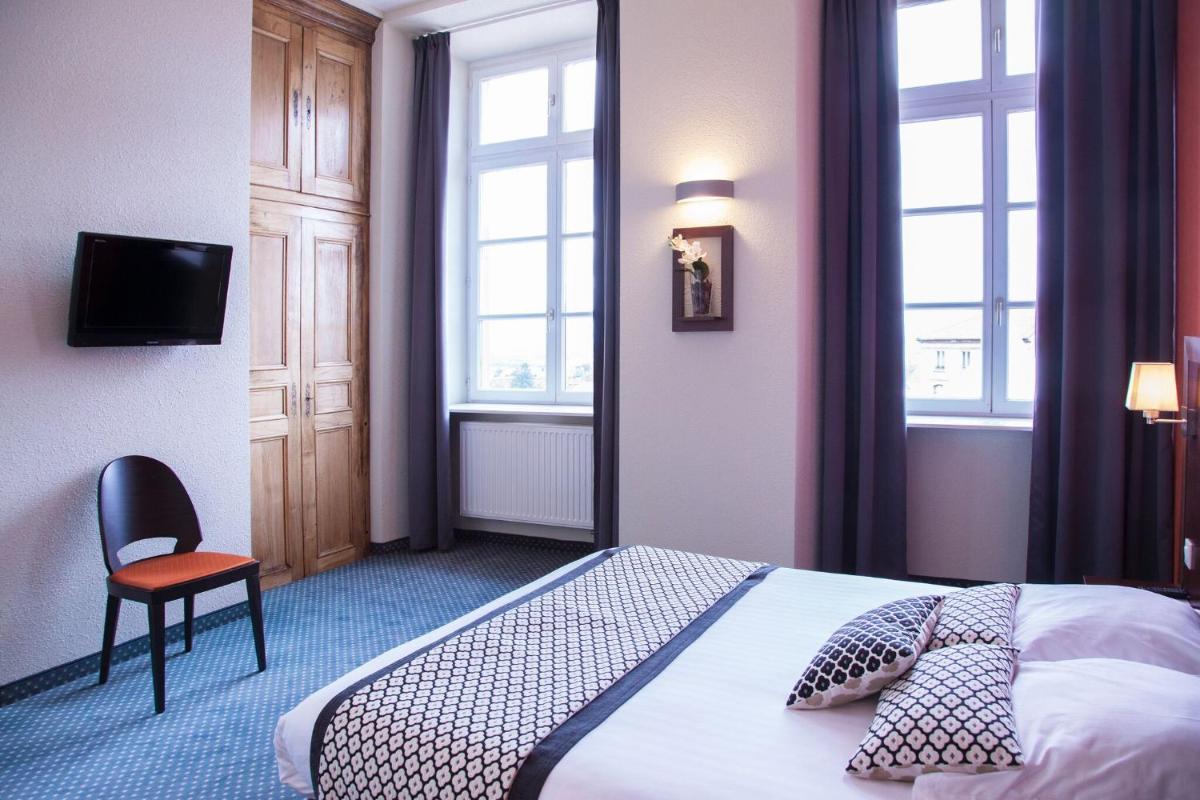 Un ou plusieurs lits dans un hébergement de l'établissement Hôtel Val-Vignes Colmar Haut-Koenigsbourg, The Originals Relais