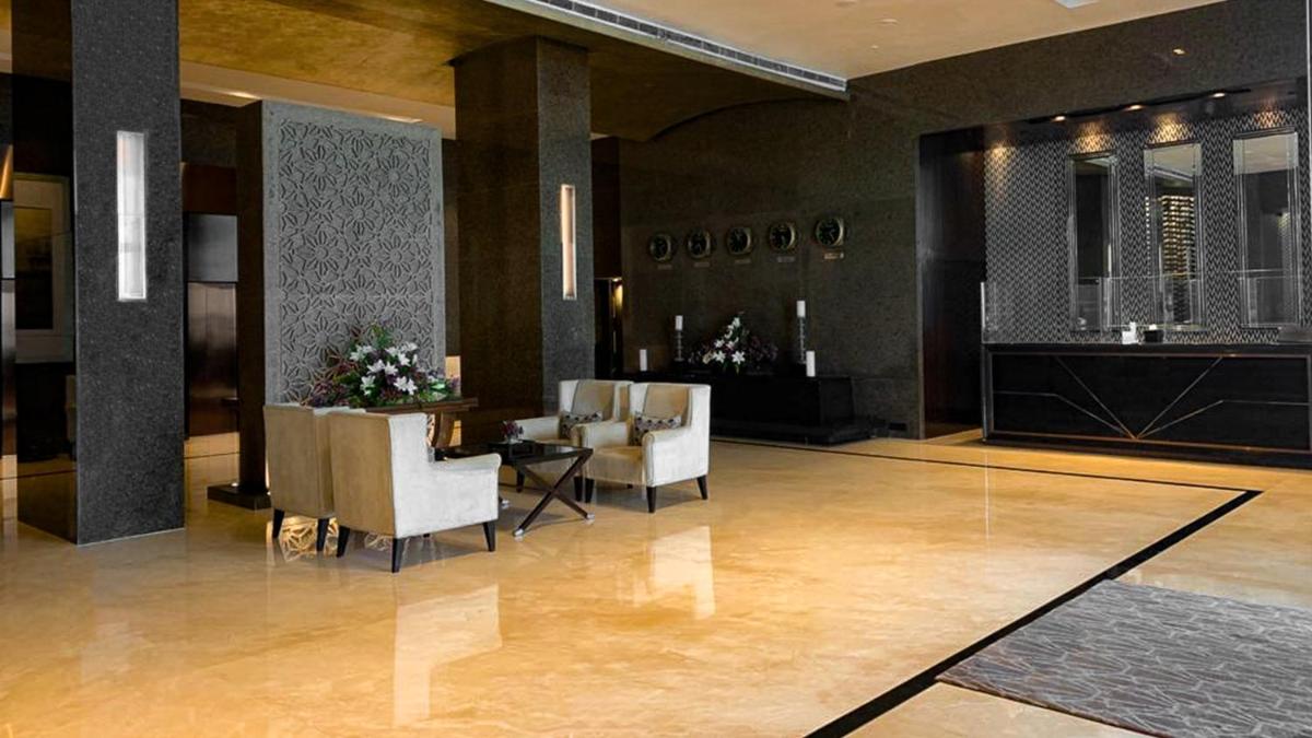 a lobby with chairs and a table in a building at InterContinental Marine Drive Mumbai by IHG in Mumbai