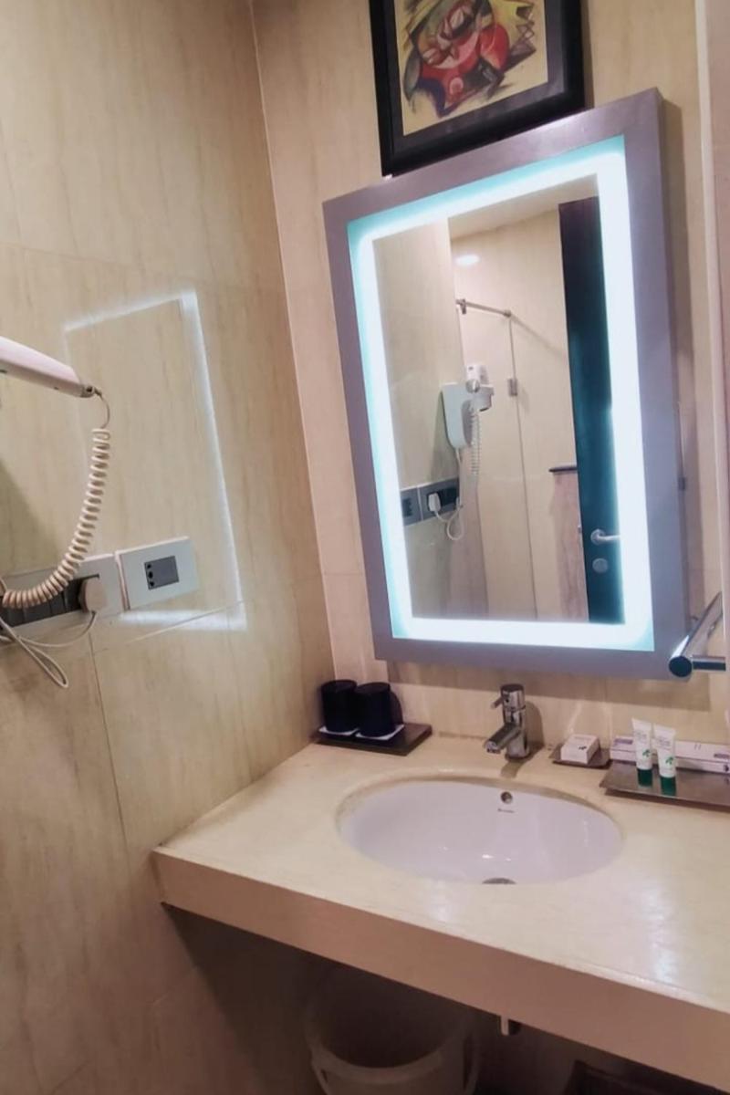 a bathroom with a sink and a mirror at Fortune Select Grand Ridge, Tirupati - Member ITC Hotels' Group in Tirupati