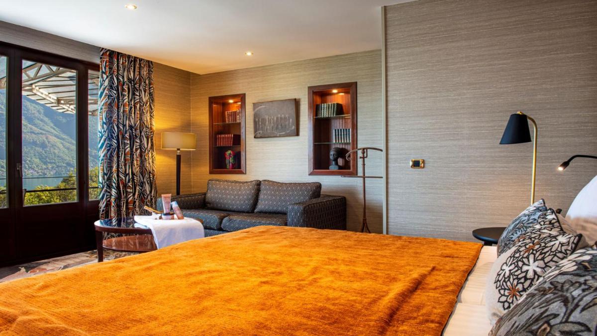 Un ou plusieurs lits dans un hébergement de l'établissement Les Trésoms Lake and Spa Resort