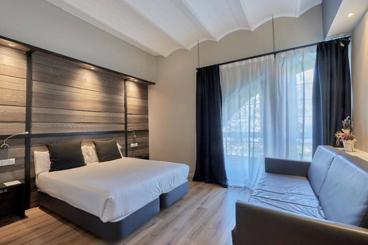 Cama o camas de una habitación en Hotel Parada Puigcerda