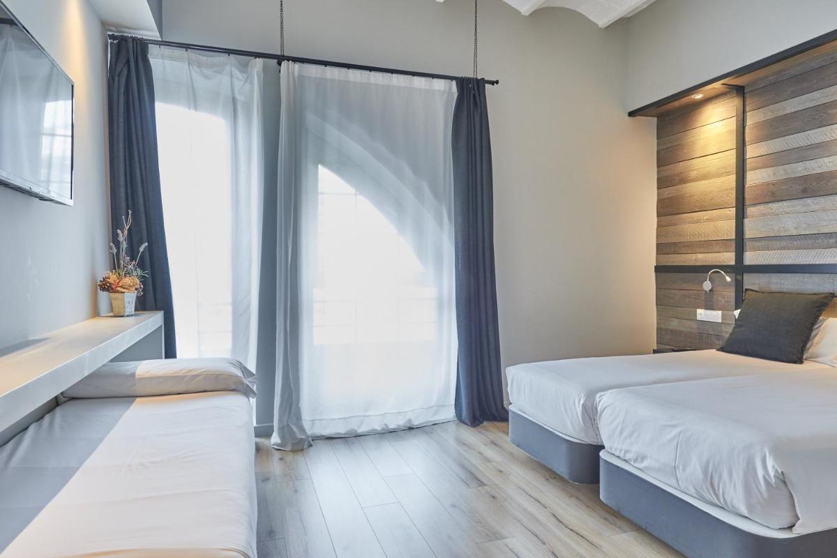 Cama o camas de una habitación en Hotel Parada Puigcerda