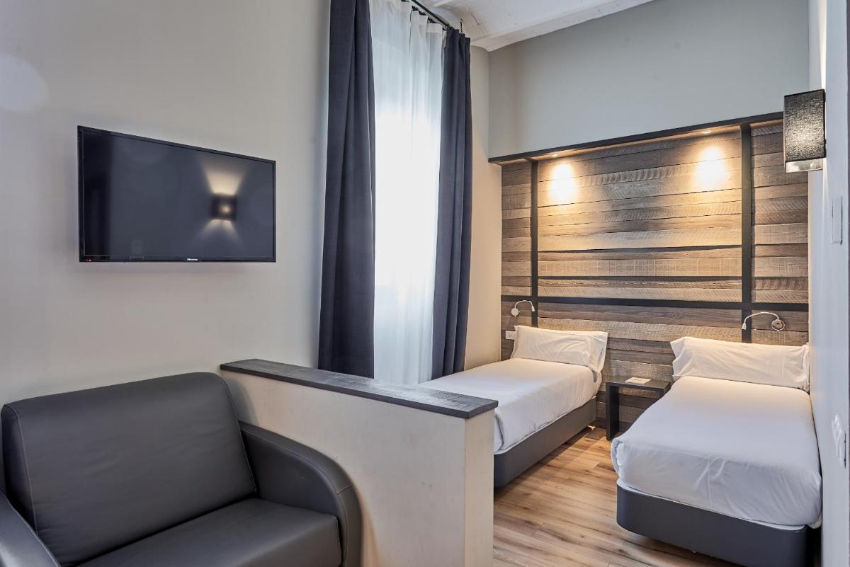 Cama o camas de una habitación en Hotel Parada Puigcerda
