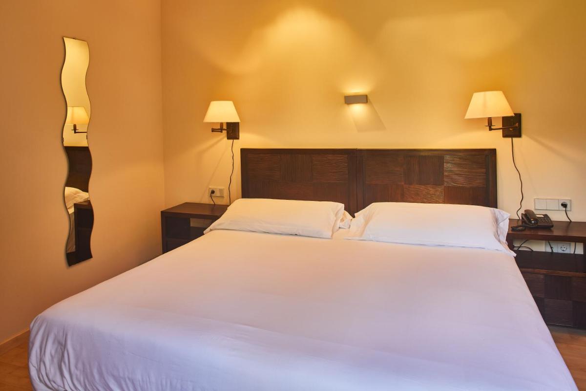 Cama o camas de una habitación en Silken Ordesa