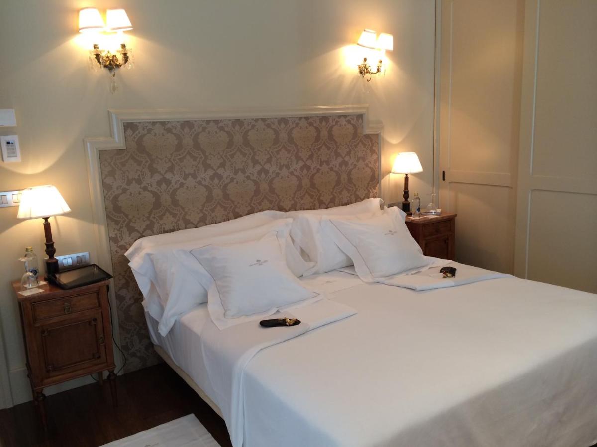 Cama o camas de una habitación en Gran Hotel La Perla