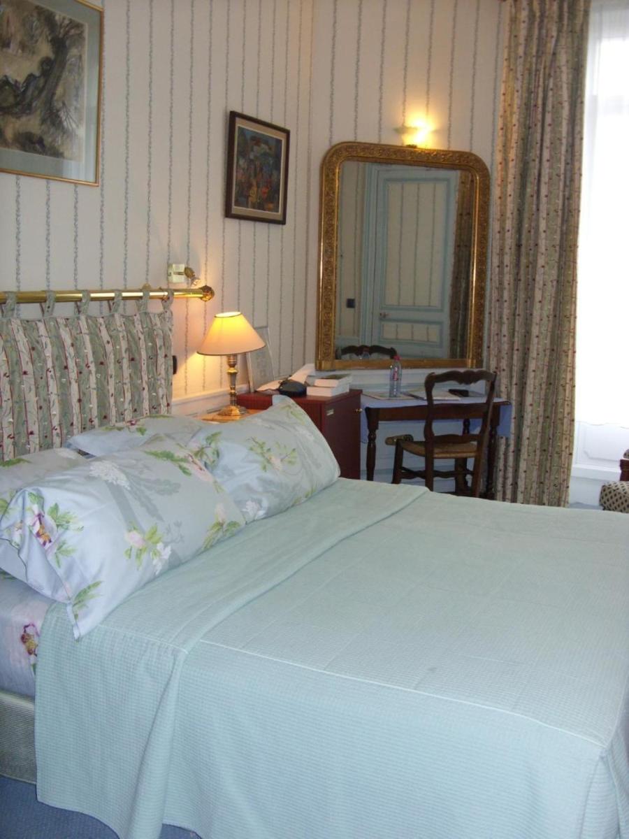 Un ou plusieurs lits dans un hébergement de l'établissement Hôtel L'Ecrin