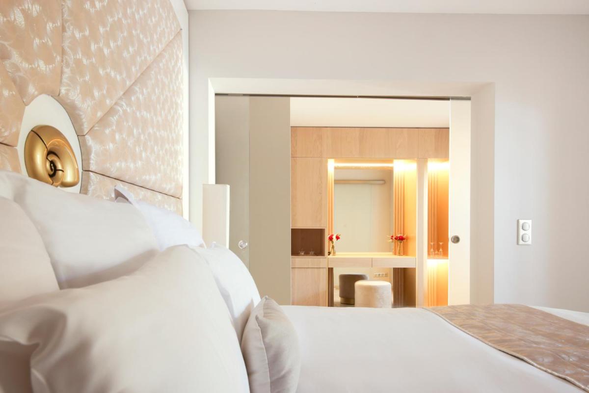 Un ou plusieurs lits dans un hébergement de l'établissement Hôtel Marinca & Spa
