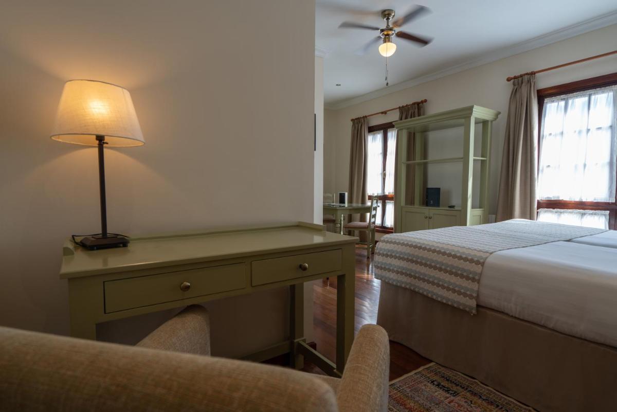 Cama o camas de una habitación en Laguna Nivaria Hotel & Spa