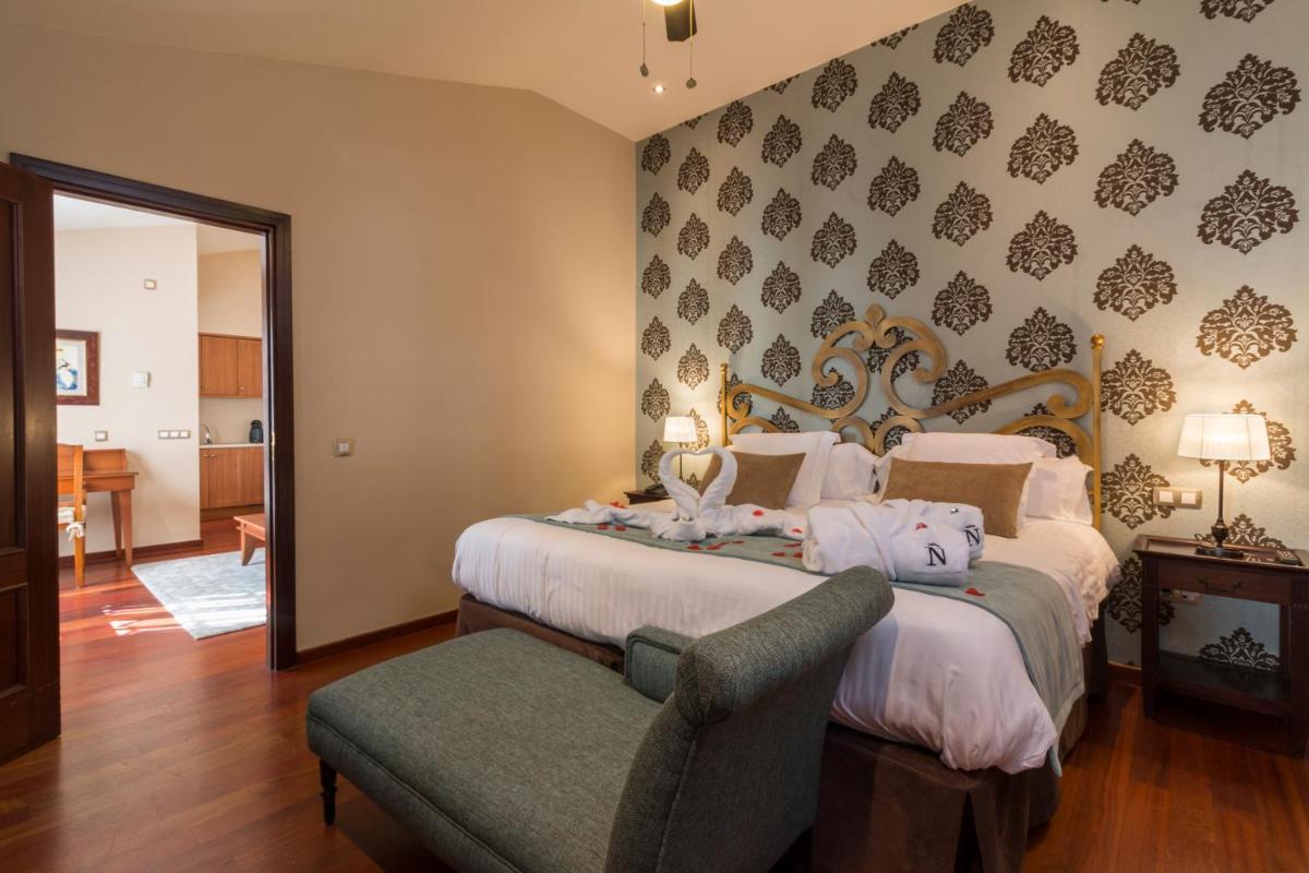Cama o camas de una habitación en Laguna Nivaria Hotel & Spa