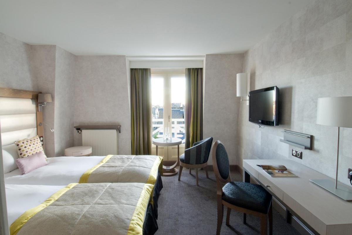 Un ou plusieurs lits dans un hébergement de l'établissement Grand Hôtel Des Thermes