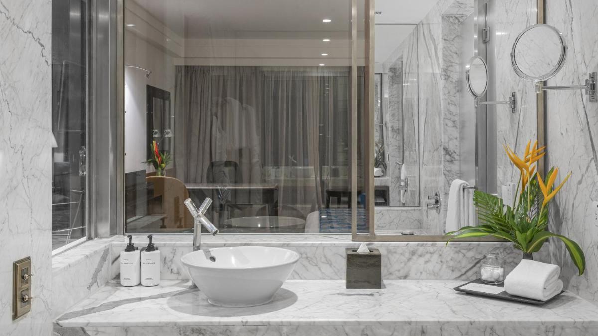 a bathroom with a sink and a large shower at InterContinental Marine Drive Mumbai by IHG in Mumbai