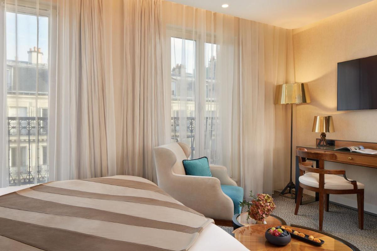Un ou plusieurs lits dans un hébergement de l'établissement Maison Albar - Le Pont-Neuf