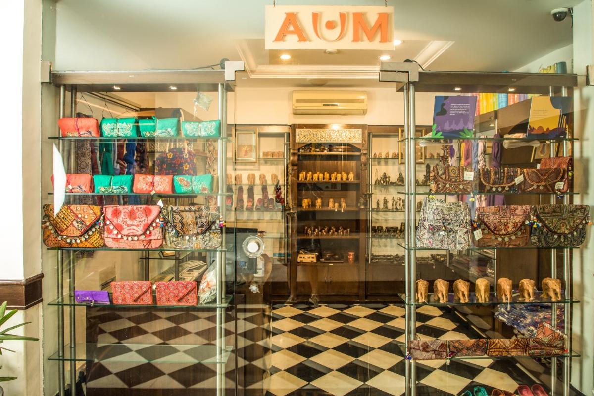 a store front of a store with a am sign on the window at The Lalit Laxmi Vilas Palace in Udaipur