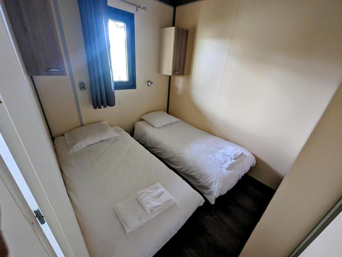Un ou plusieurs lits dans un hébergement de l'établissement Lodge Hôtel & Spa Les Voiles du Grand Large
