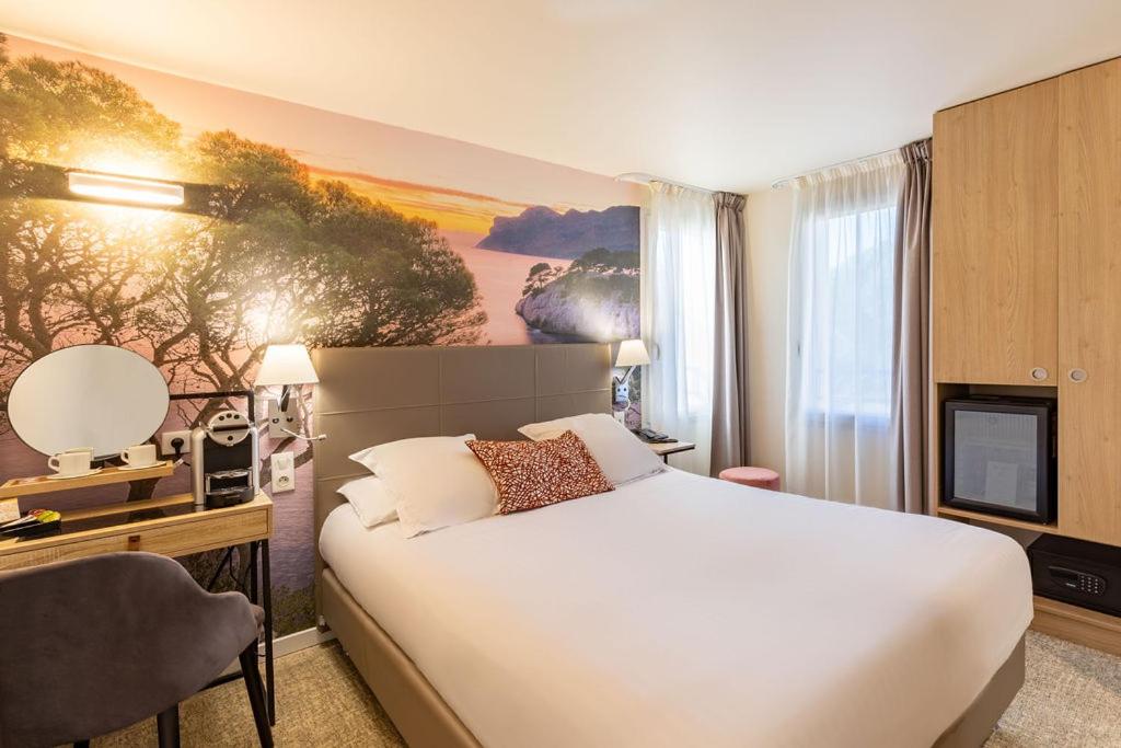 Un ou plusieurs lits dans un hébergement de l'établissement Best Western Hotel & SPA Coeur De Cassis