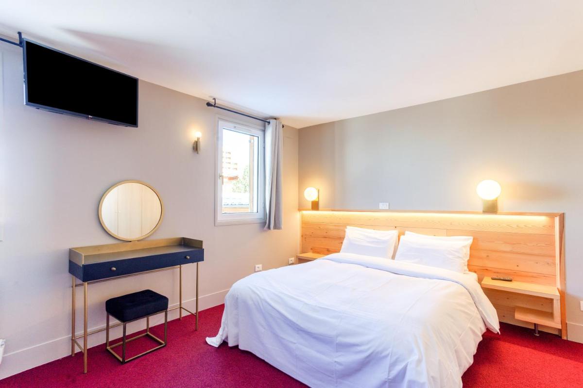 Un ou plusieurs lits dans un hébergement de l'établissement Hotel Turan & Spa