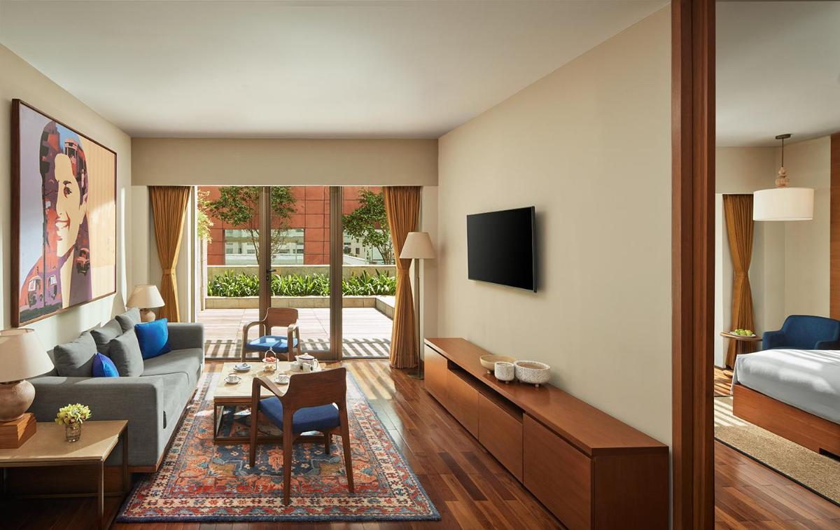 a living room with a couch and a bed at Taj City Centre New Town, Kolkata in Kolkata a living room with a couch and a bed at Taj City Centre New Town, Kolkata in Kolkata