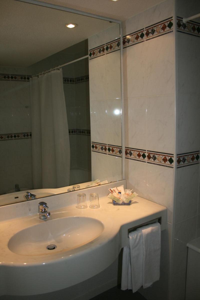 Salle de bains dans l'établissement Best Western Hotel Sourcéo