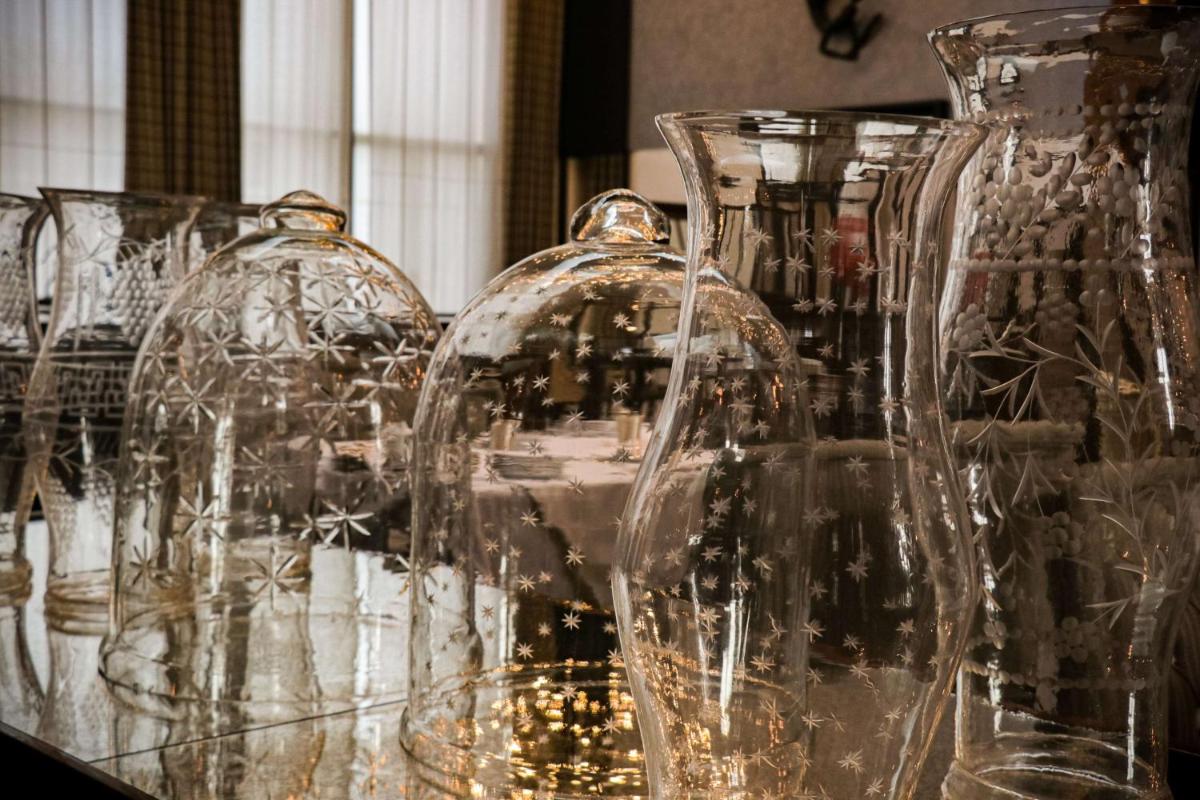 a group of glass vases sitting on a table at Grand Hyatt Gurgaon in Gurgaon
