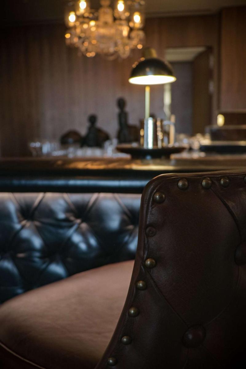 a close up of a leather chair in a room at Grand Hyatt Gurgaon in Gurgaon