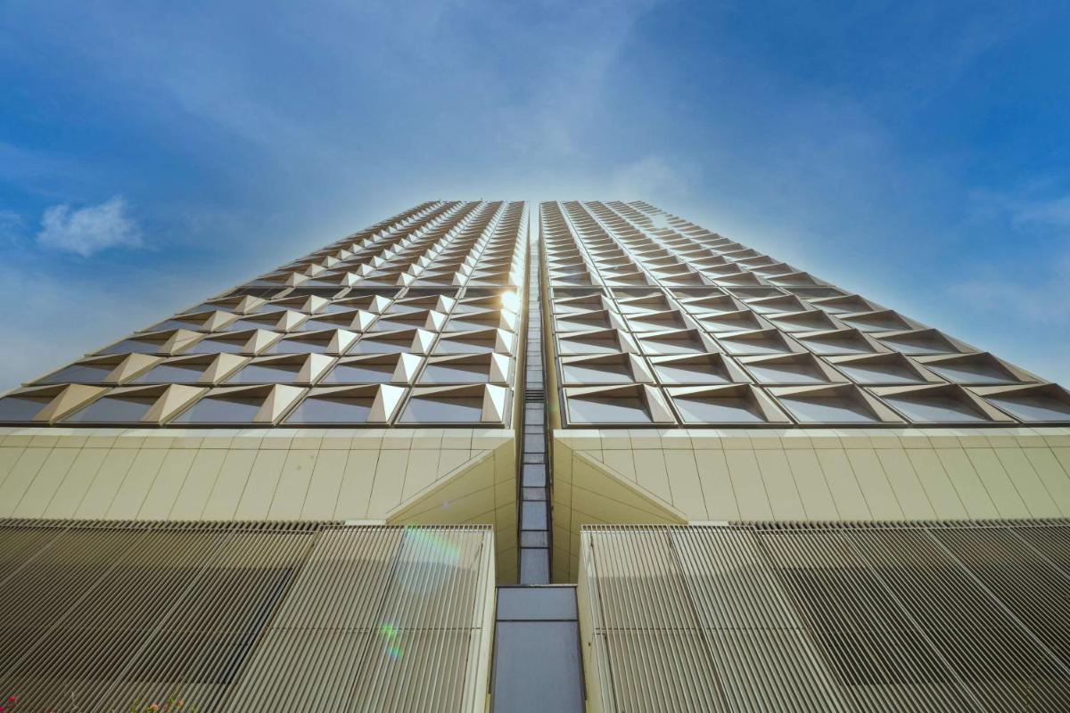 a tall building with windows on the side of it at Grand Hyatt Gurgaon in Gurgaon