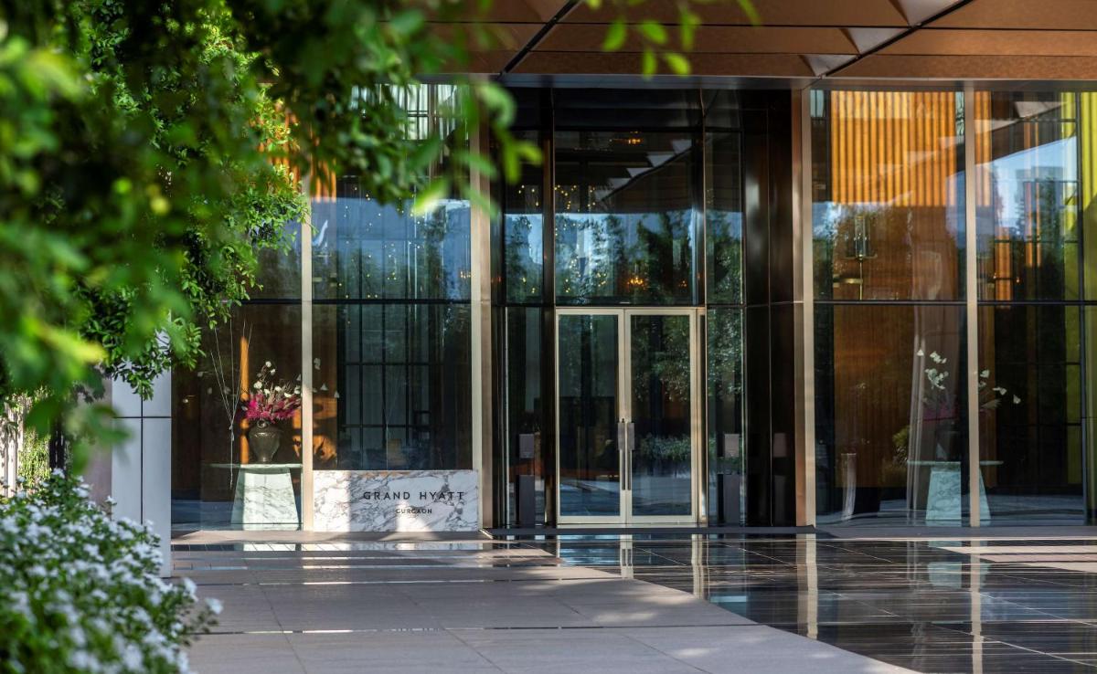 an entrance to a building with glass doors at Grand Hyatt Gurgaon in Gurgaon