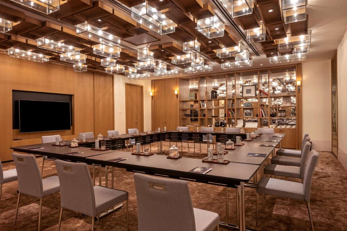 a large conference room with a large table and chairs at Grand Hyatt Gurgaon in Gurgaon