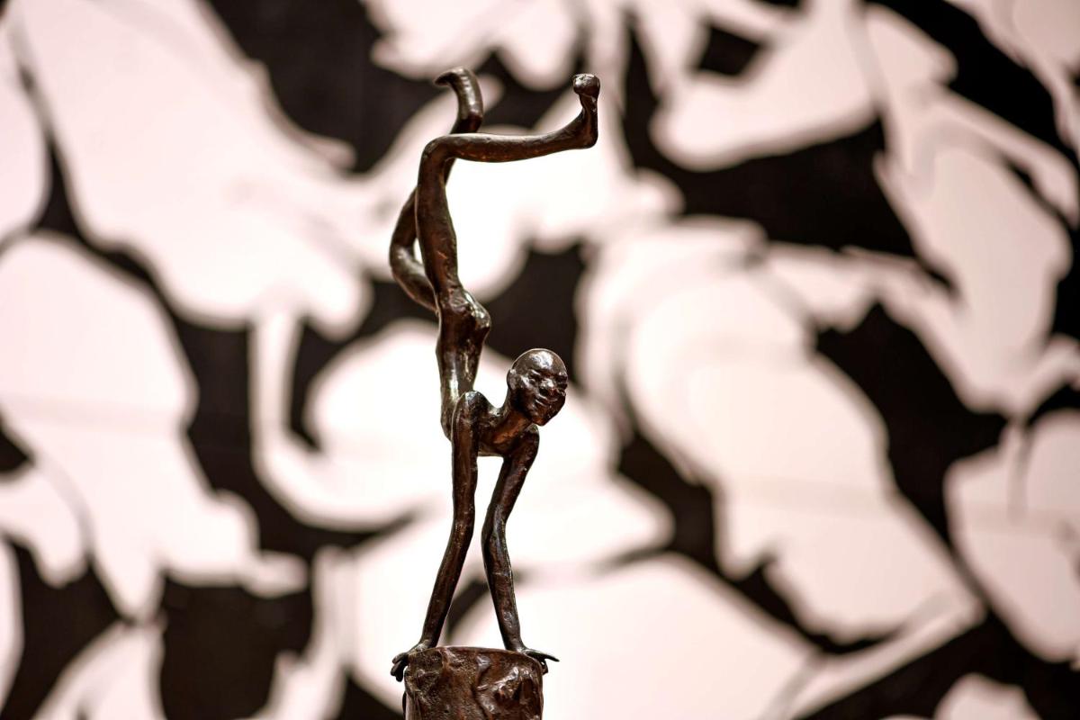a bronze statue of a person doing a jump at Grand Hyatt Gurgaon in Gurgaon