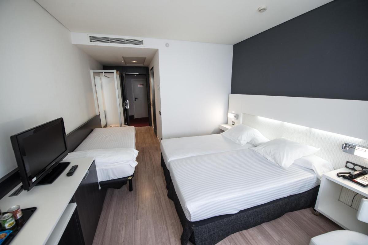 Cama o camas de una habitación en Axor Feria
