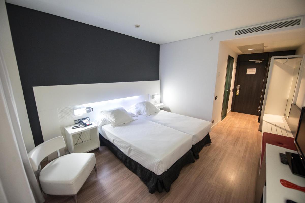 Cama o camas de una habitación en Axor Feria
