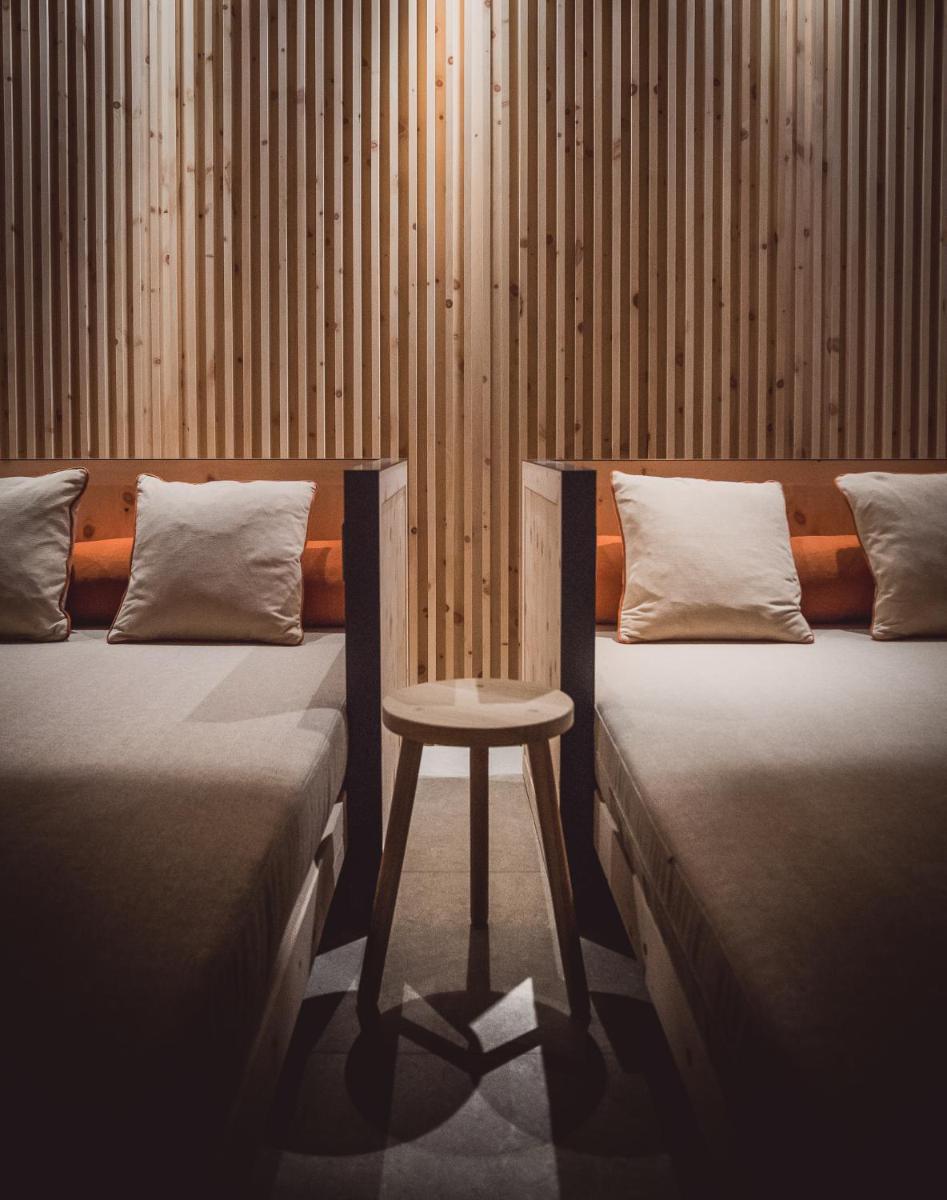 Ein Bett oder Betten in einem Zimmer der Unterkunft Spa & Resort Bachmair Weissach, LUXURY FAMILY RESORT