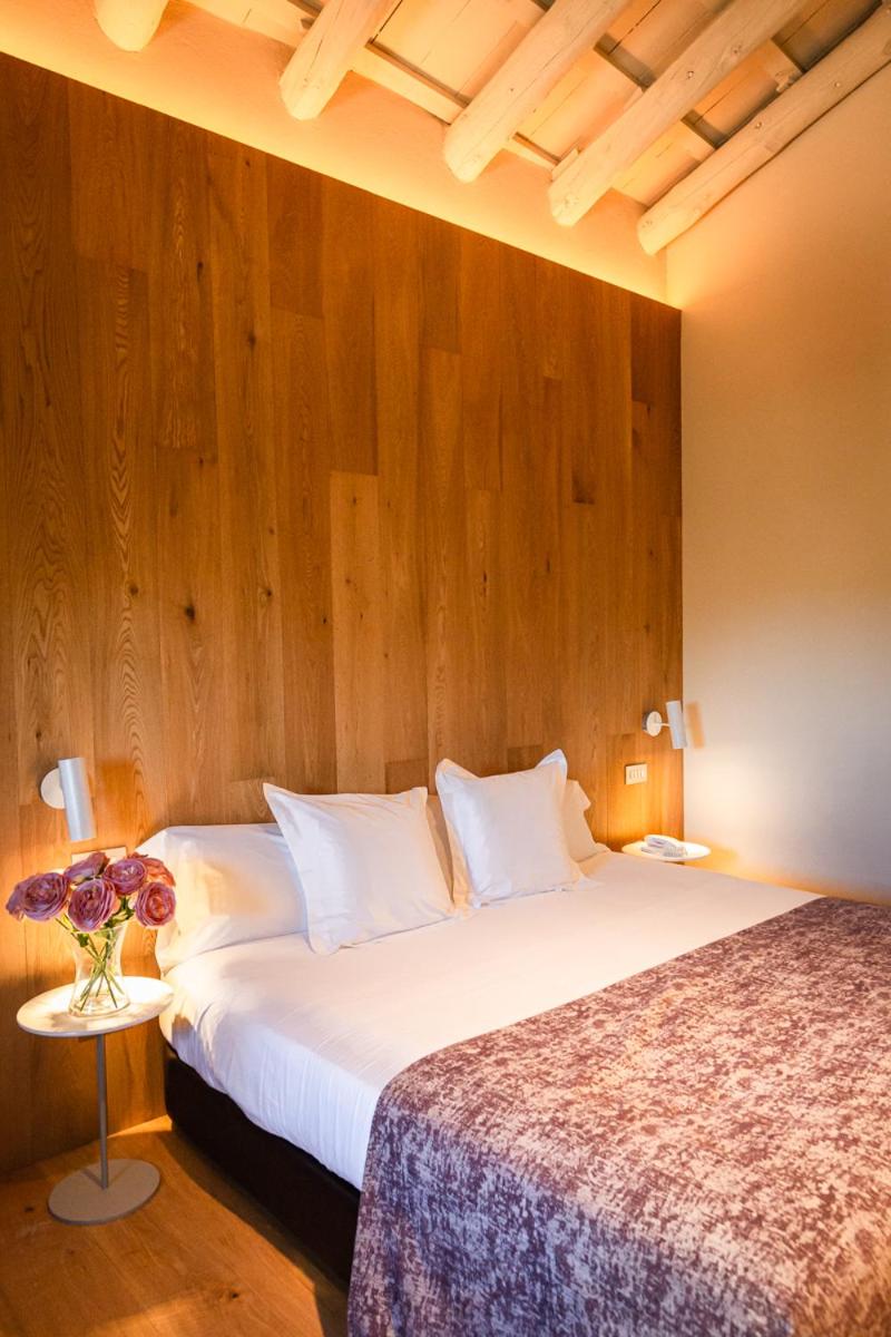 Cama o camas de una habitación en Hotel Mas Bosch 1526