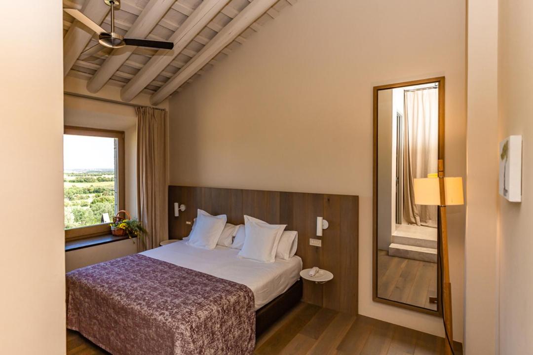 Cama o camas de una habitación en Hotel Mas Bosch 1526