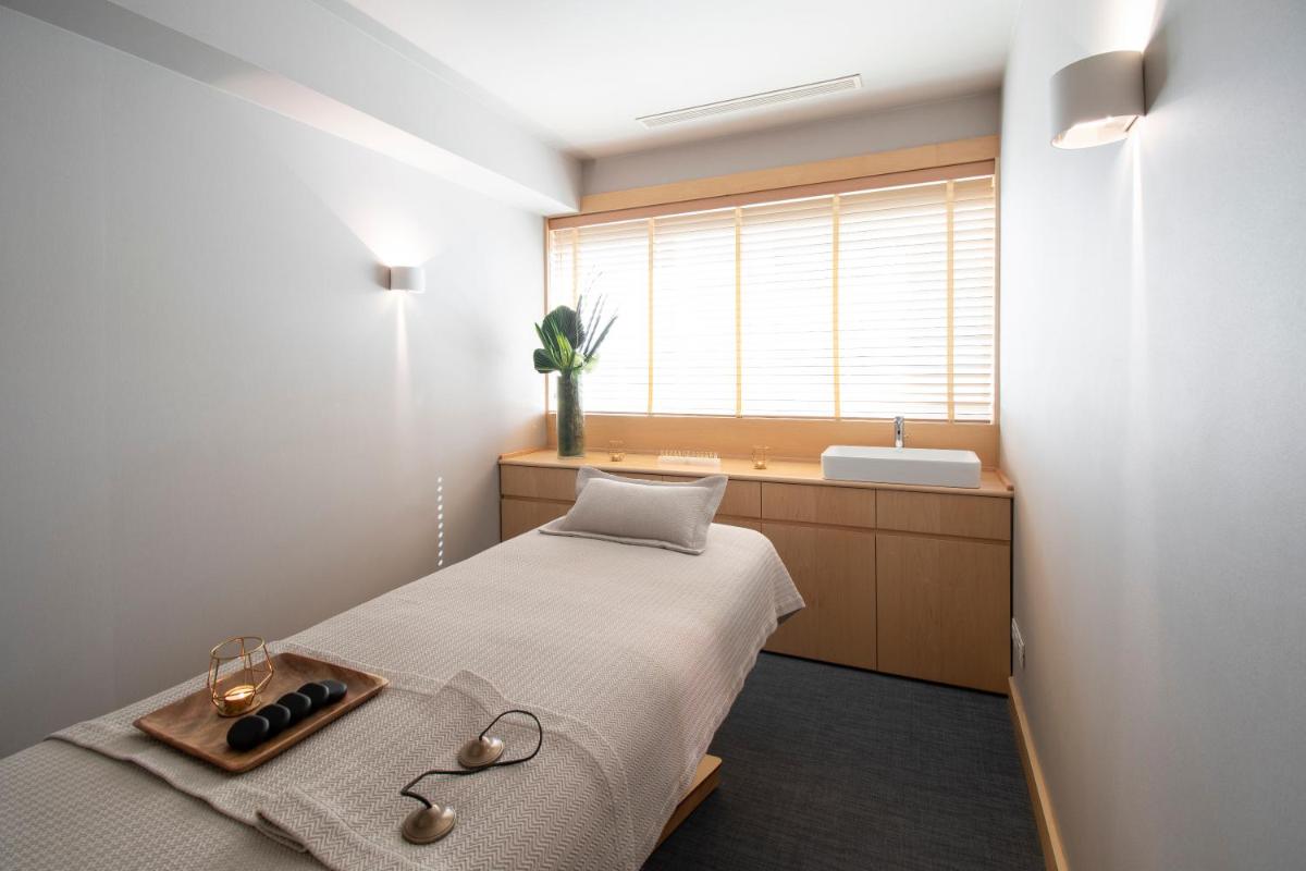 Uma cama ou camas num quarto em SANA Malhoa Hotel