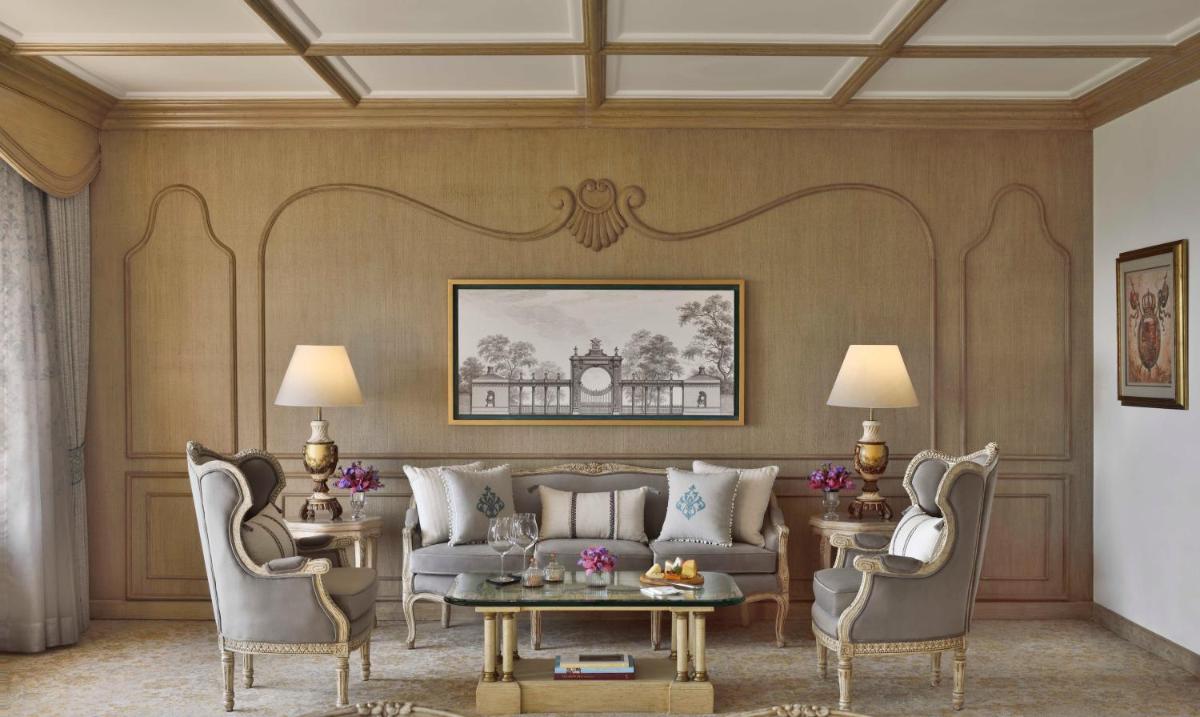 a living room with a couch and chairs and a table at Taj Mahal, New Delhi in New Delhi