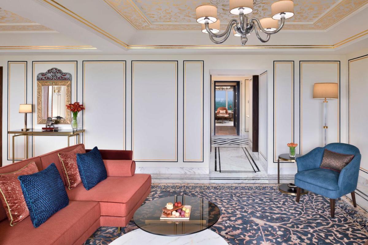 a living room with a couch and a chair at Taj Mahal, New Delhi in New Delhi